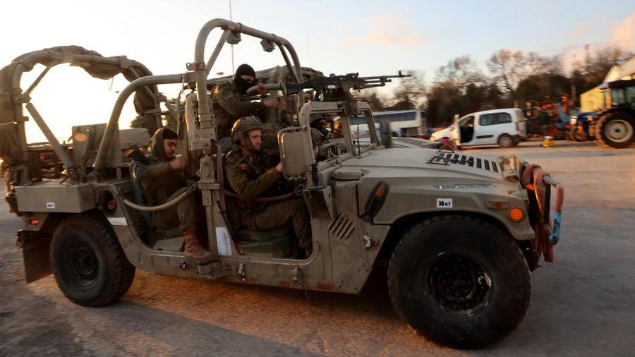 Israeli army controls border areas, strikes strategic weapons in Syria