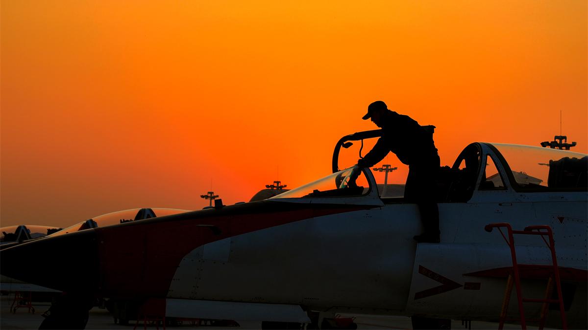 Maintenance man conducts pre-flight inspections