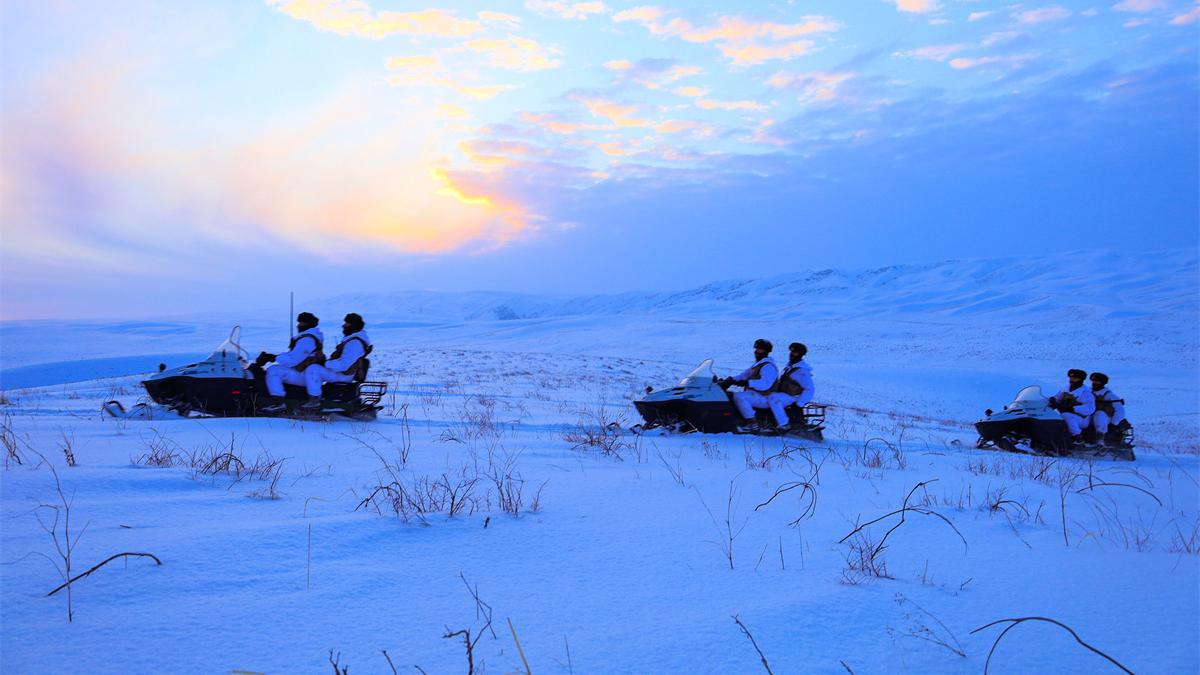 Soldiers patrol border area