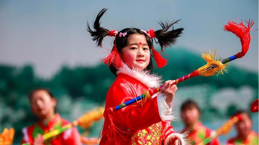 Young girl performs Pan Drum dance
