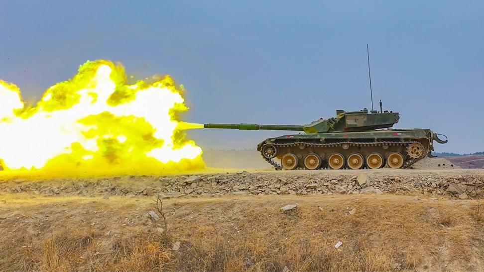 MBTs fire at mock targets