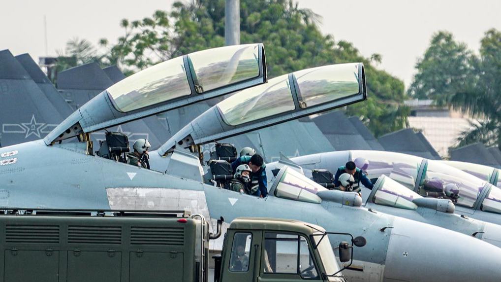 J-16 fighter jets engage in flight training