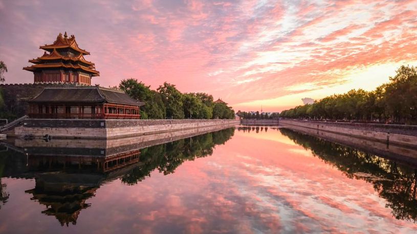 Turret of Palace Museum bathed in evening glow in Beijing