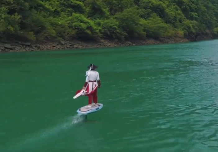 ​​E-foiling over emerald waters