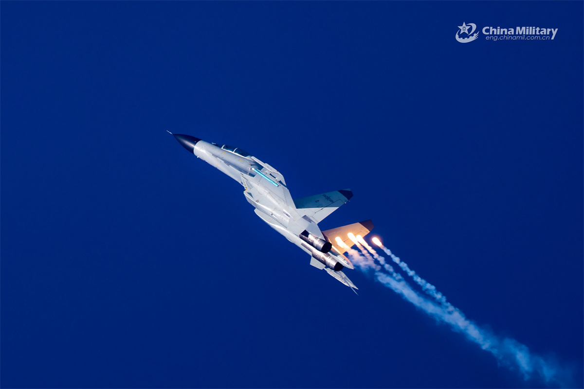 Naval fighter jets in flight training exercise