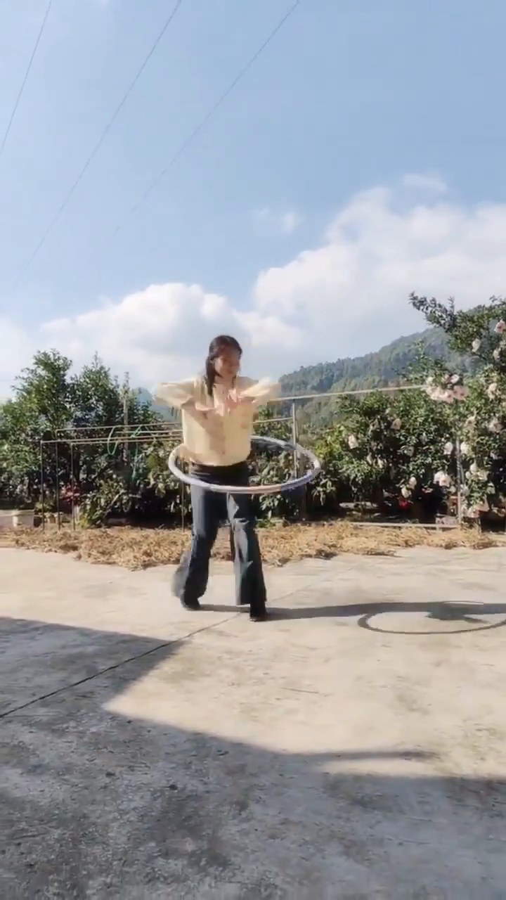 Graceful hula hoop dance