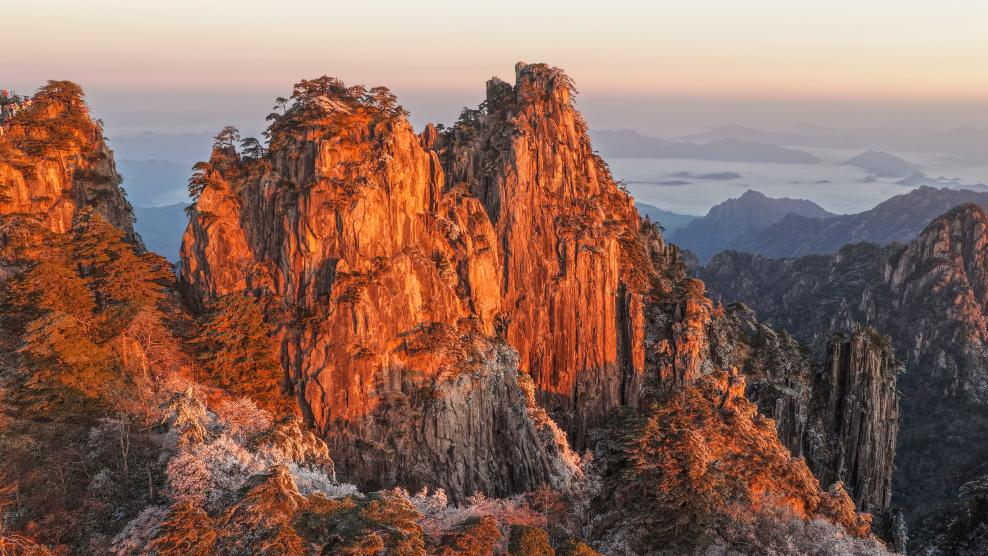 Scenery of Huangshan Mountain scenic area at sunrise after snow in China's Anhui