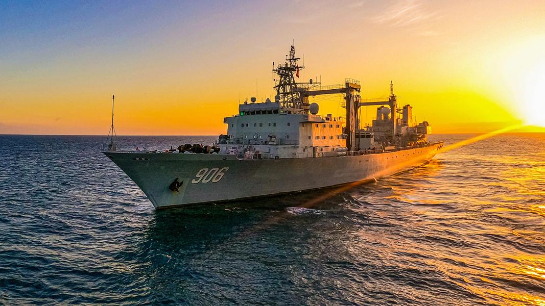 Comprehensive supply ships steam in formation