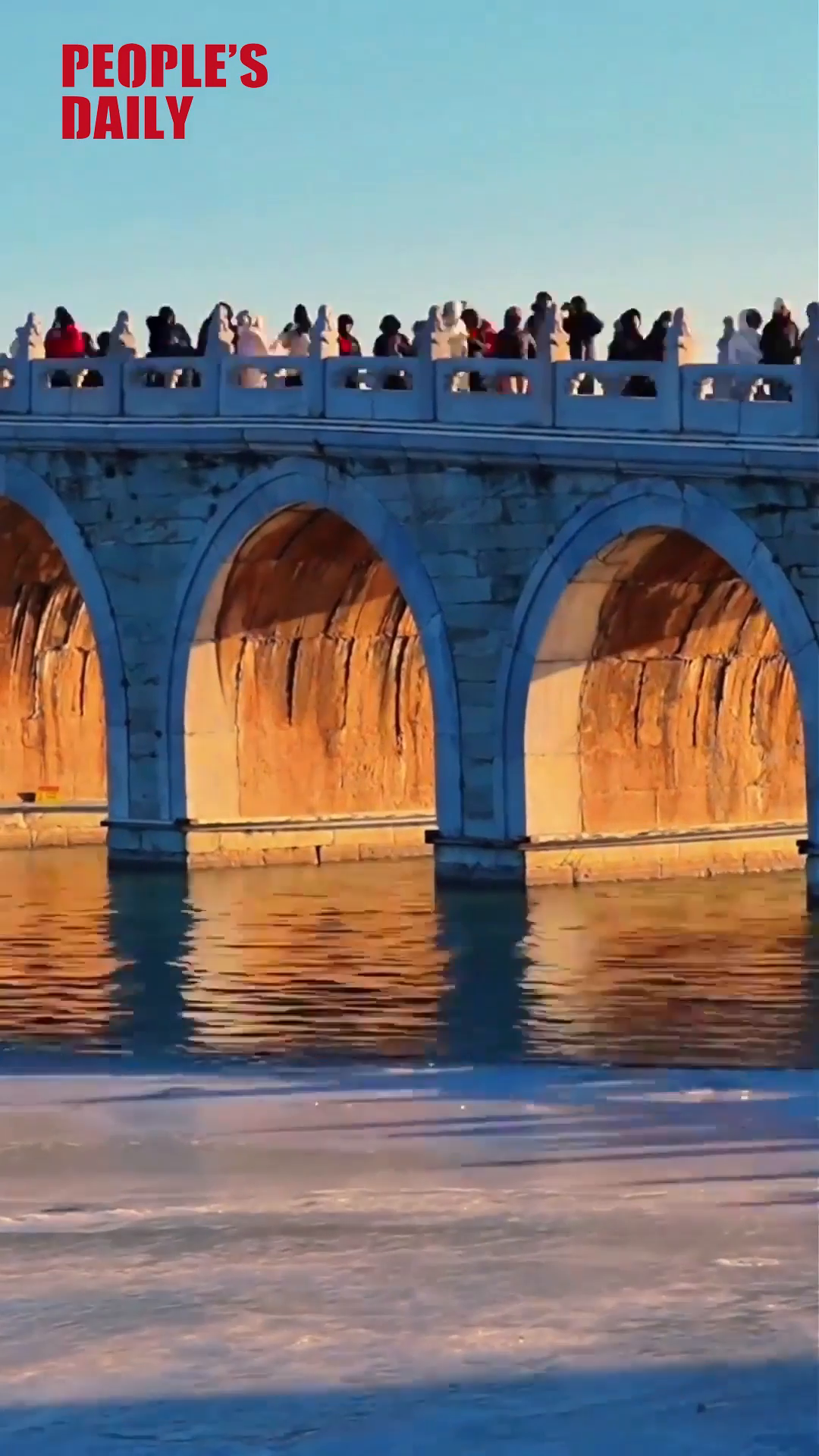 Golden light pierces arches at Beijing's Summer Palace