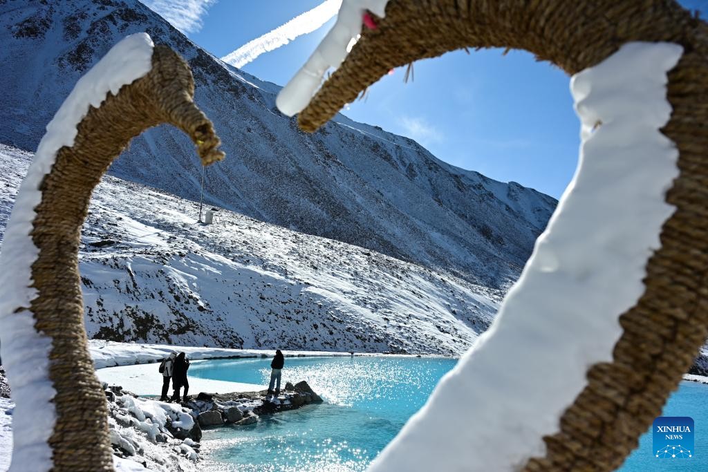 Snow-covered Mt. Gangshika in China's Qinghai attracts tourists in winter