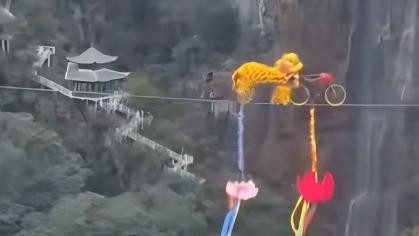 Daring bike lion dance over canyon