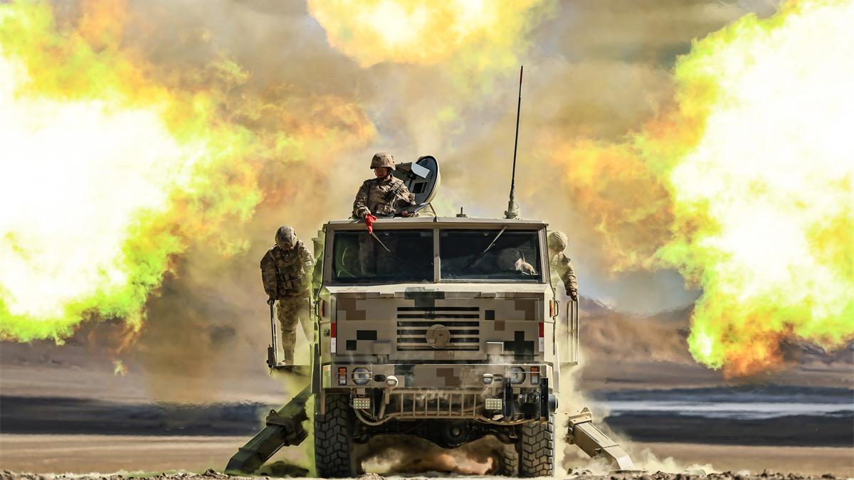 Wheeled self-propelled howitzers spit fire at targets