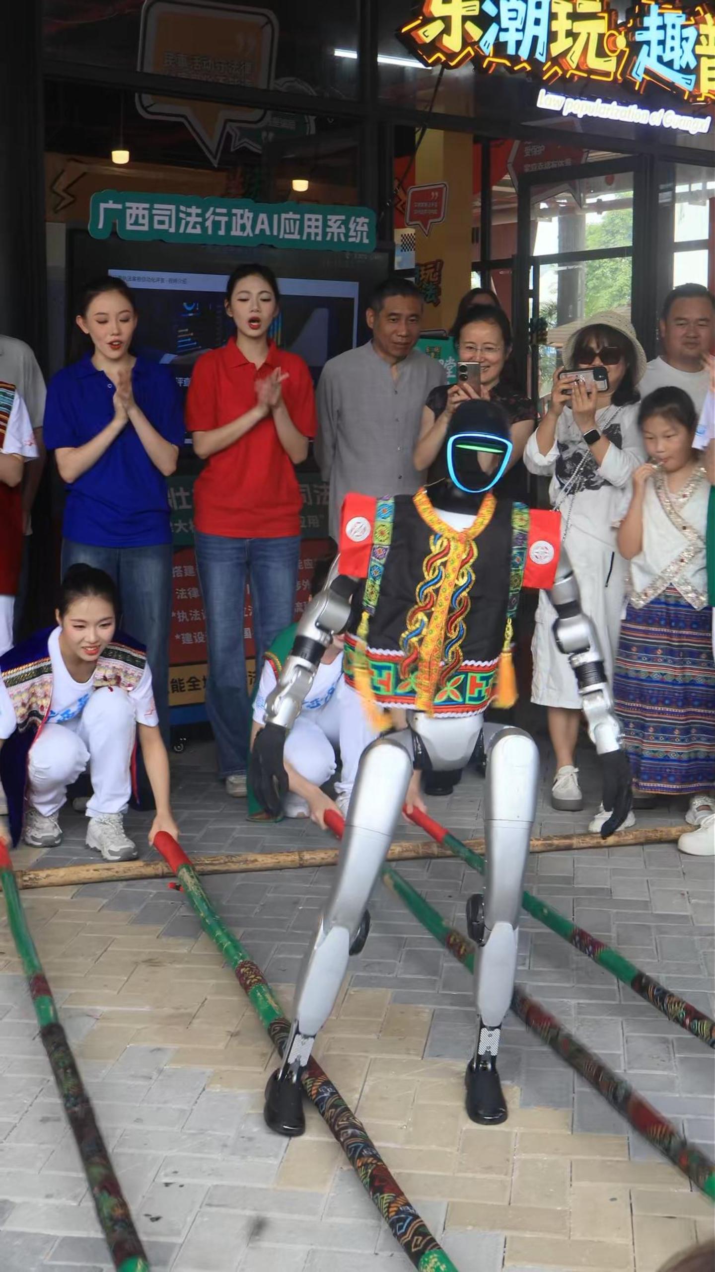 Robot performs bamboo pole dance during traditional Sanyuesan Festival in S China's Guangxi