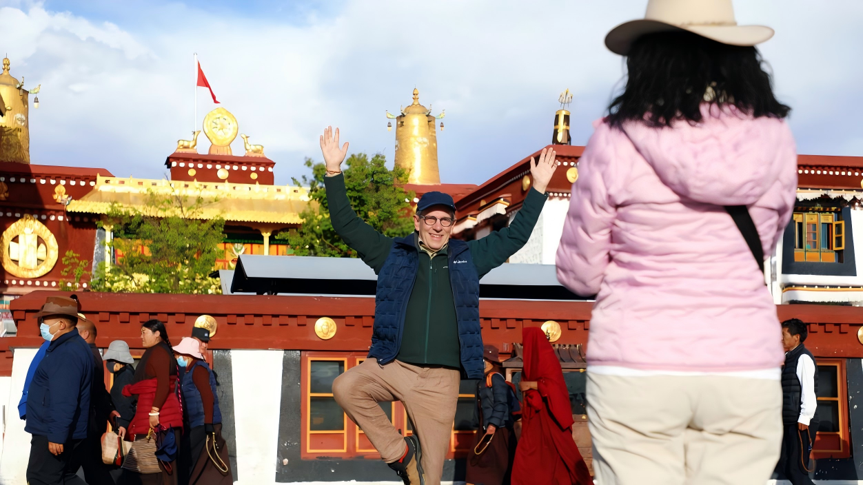 Foreign tourists explore Barkhor Street, Lhasa, SW China's Xizang