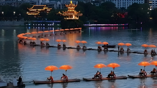 Bamboo rafts form a 'dragon' lighting up nights in SW China