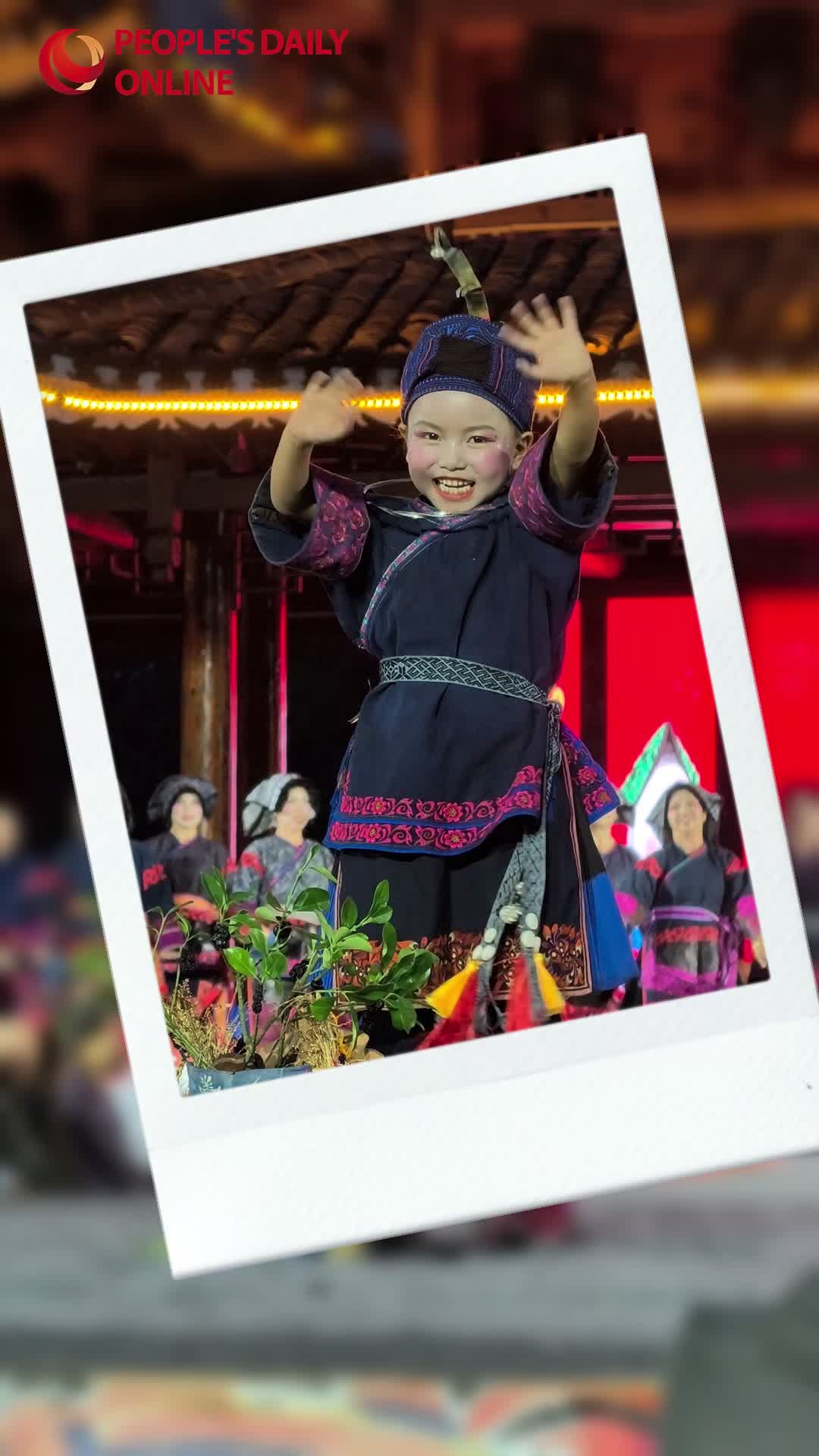 Children in ethnic attire shine on grassroots runway in SW China