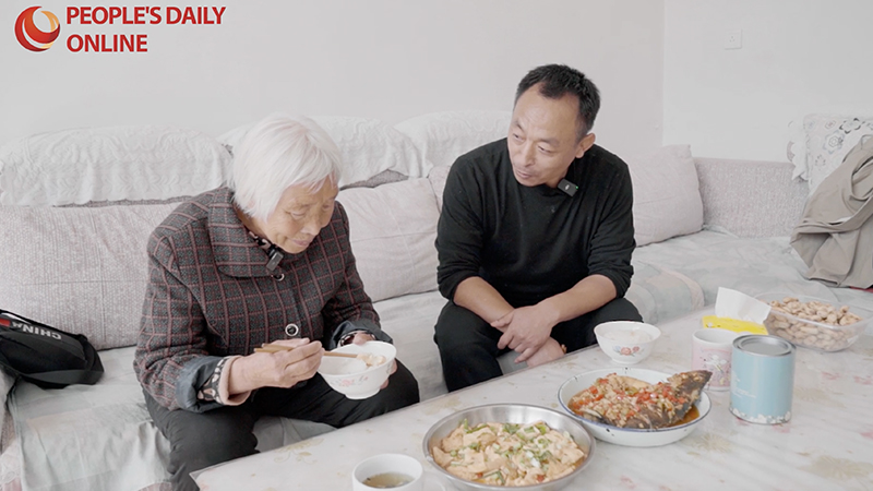 A meal brings rural Party official and elderly villager closer