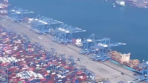 Bustling Qingdao Port: Container stacks resemble huge building blocks