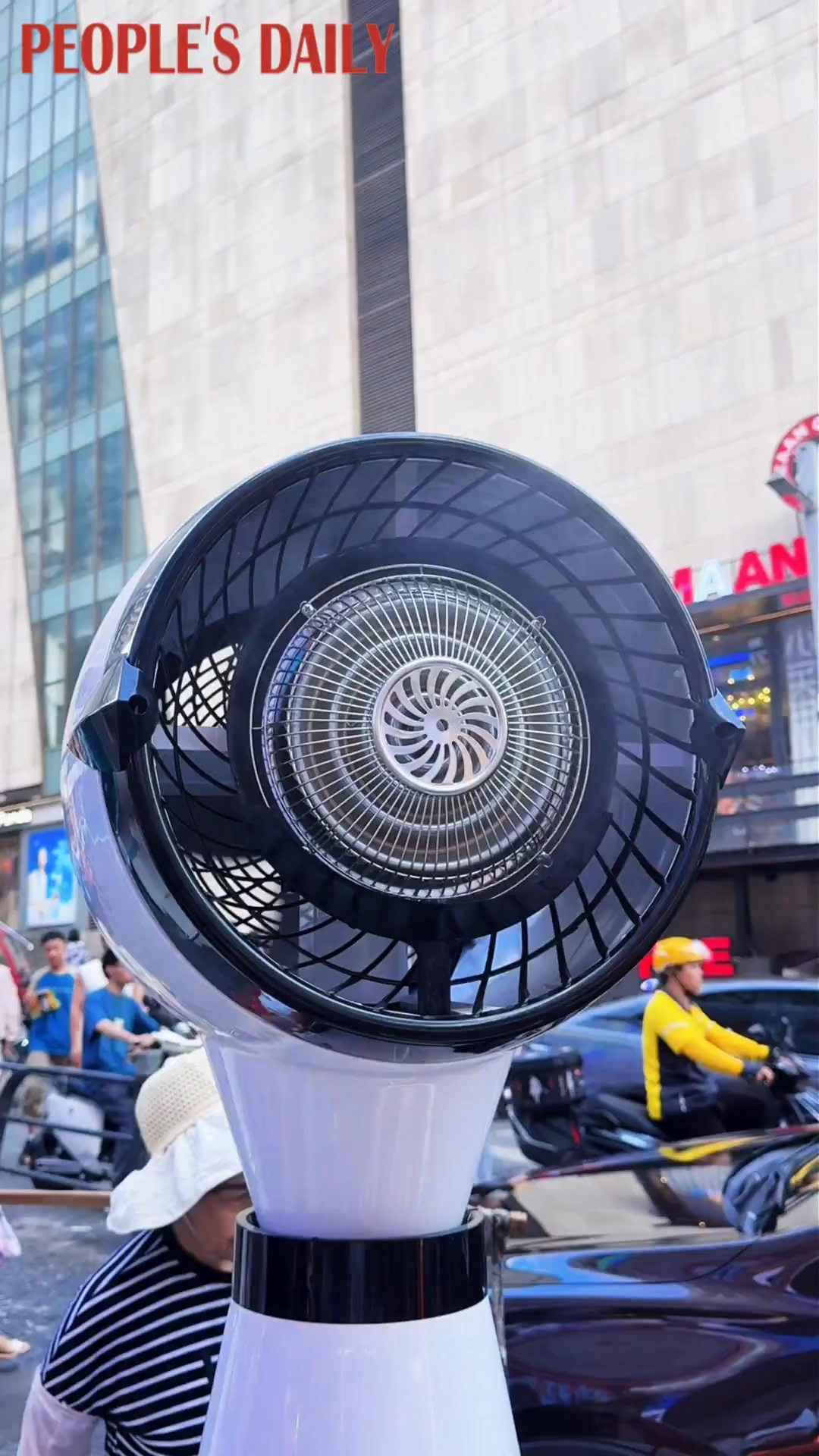 Giant fans bring cool relief to sweltering streets of Chongqing