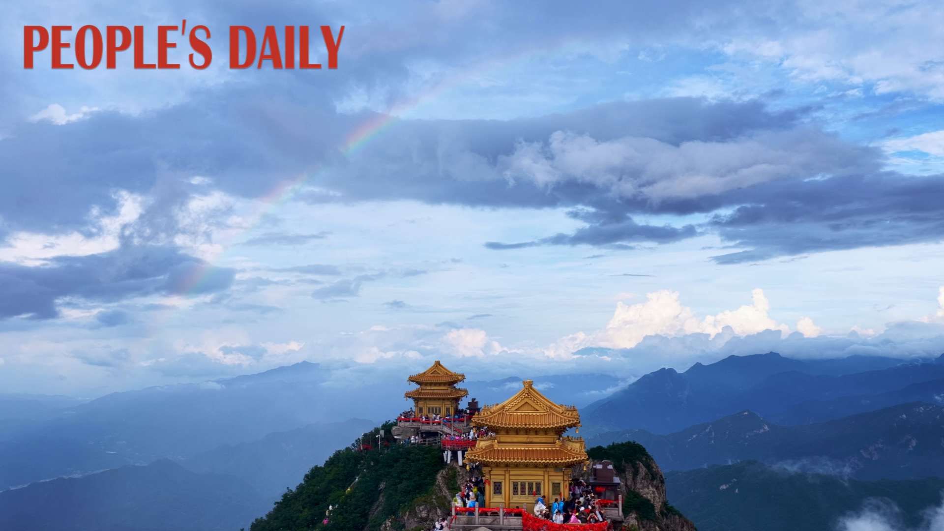 Rainbow arches over temples atop Laojun Mountain in Henan