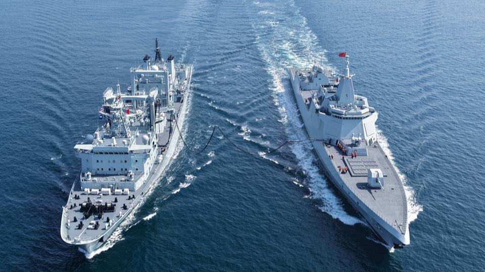 Naval vessels steam in training