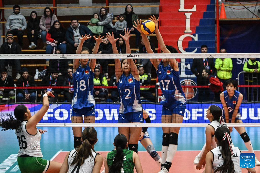 Zhang Yijia, Xu Ruilin and Niu Sidi (Top, L to R) of China block the ball during the Pool B Preliminary Phase match between China and Mexico at the FIVB Volleyball Girls' U17 World Championship in San Felipe, Chile, Aug. 10, 2026. (Photo by Jorge Villegas/Xinhua)