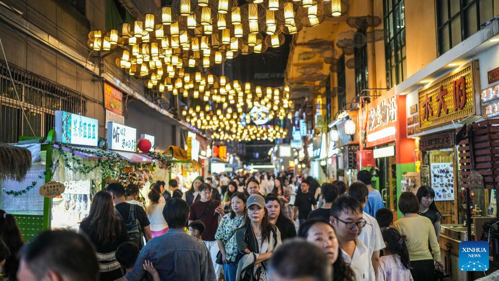 Visitors are seen at a market in Nanming District of Guiyang, southwest China's Guizhou Province, Aug. 14, 2026. The cool climate and rich tourism resources in Guizhou have attracted lots of visitors seeking a summer retreat. (Xinhua/Tao Liang)