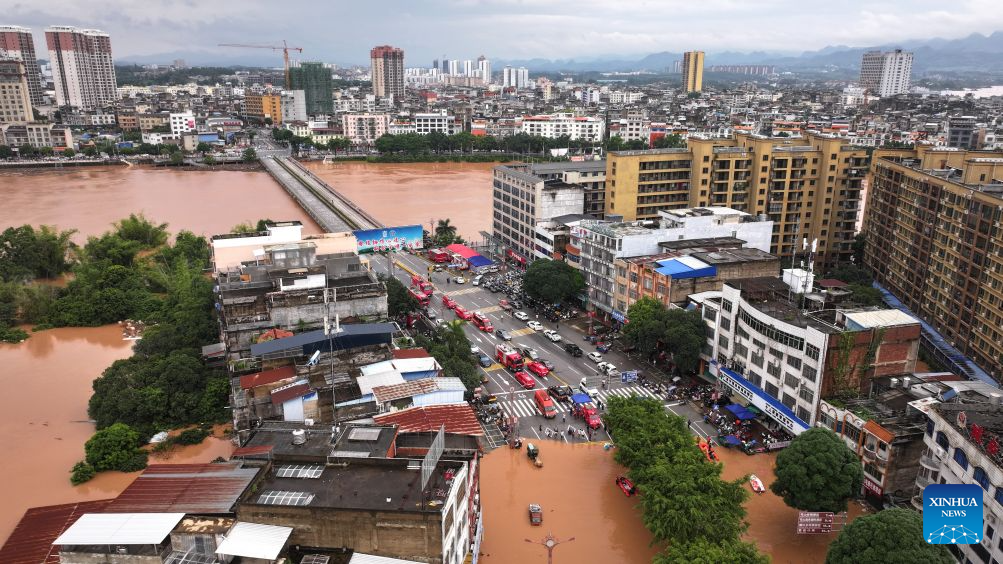 Rescuers evacuate stranded residents following heavy rains in China's Guangxi