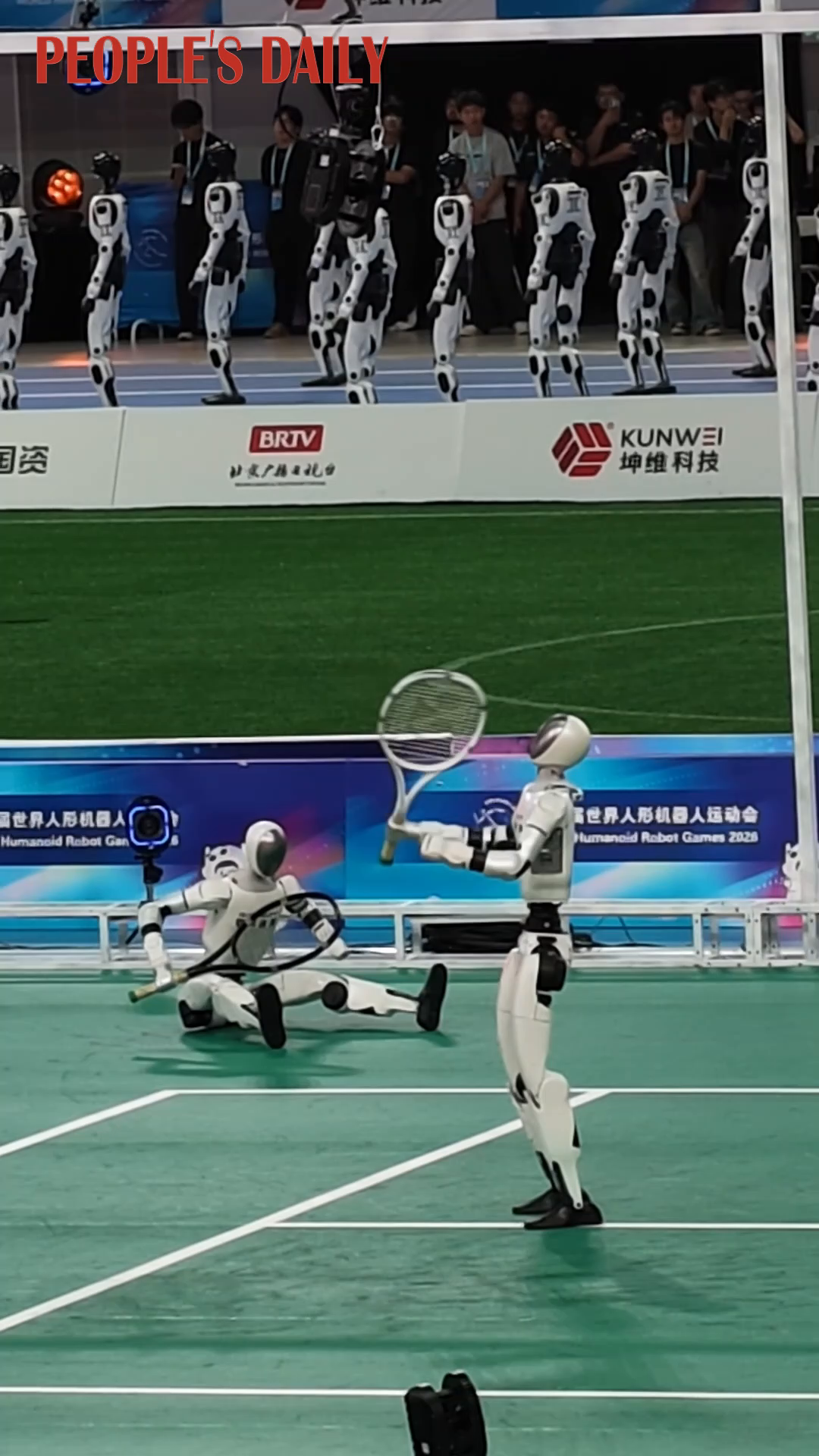 Robotic "tennis players" warm up for the match at WRC 2026