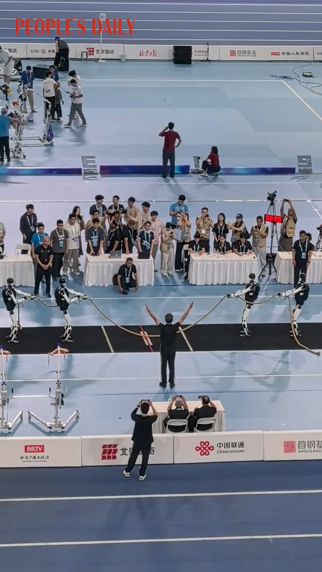 Robots win tug‑of‑war before dramatic tumble at Beijing robot games