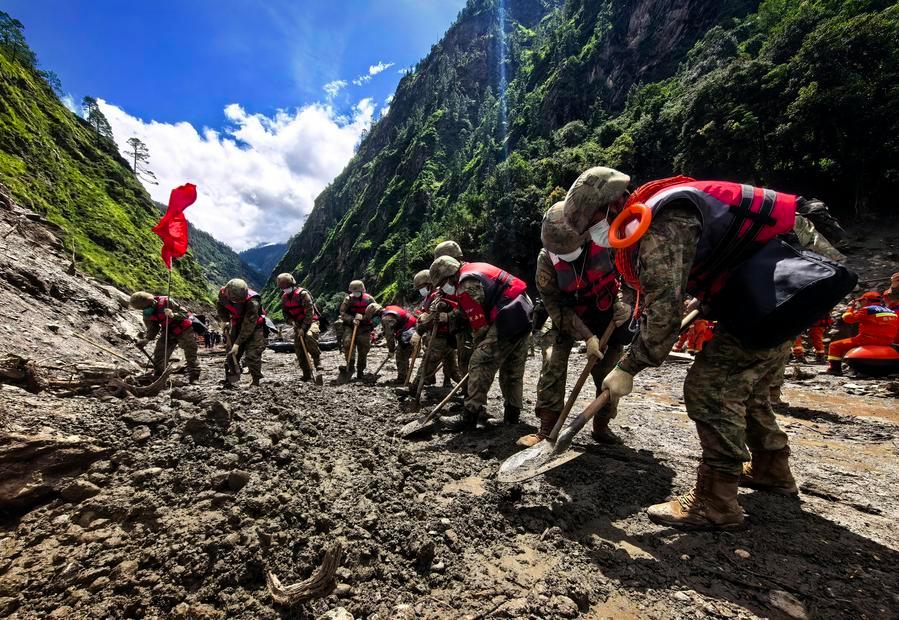 Rescuers from the Chinese People's Liberation Army work in a mudslide-hit area near Gyirong Port in Gyirong County, Xigaze, southwest China's Xizang Autonomous Region, Aug. 28, 2026. (Photo by Liu Yuqin/Xinhua)
