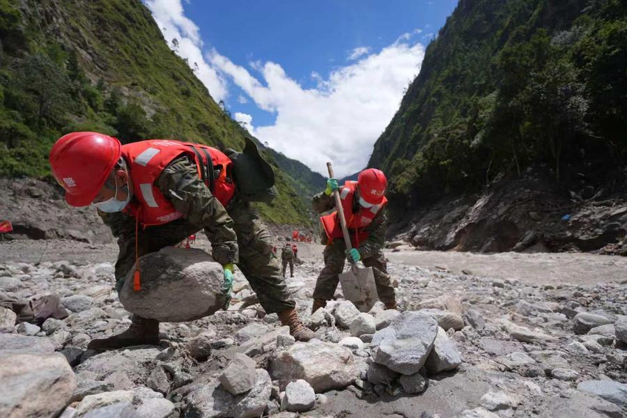 Rescuers from the People's Armed Police Force carry out search and rescue work near Gyirong Port in Gyirong County, in Xigaze, southwest China's Xizang Autonomous Region, Aug. 28, 2026. (Photo by Yang Jie/Xinhua)