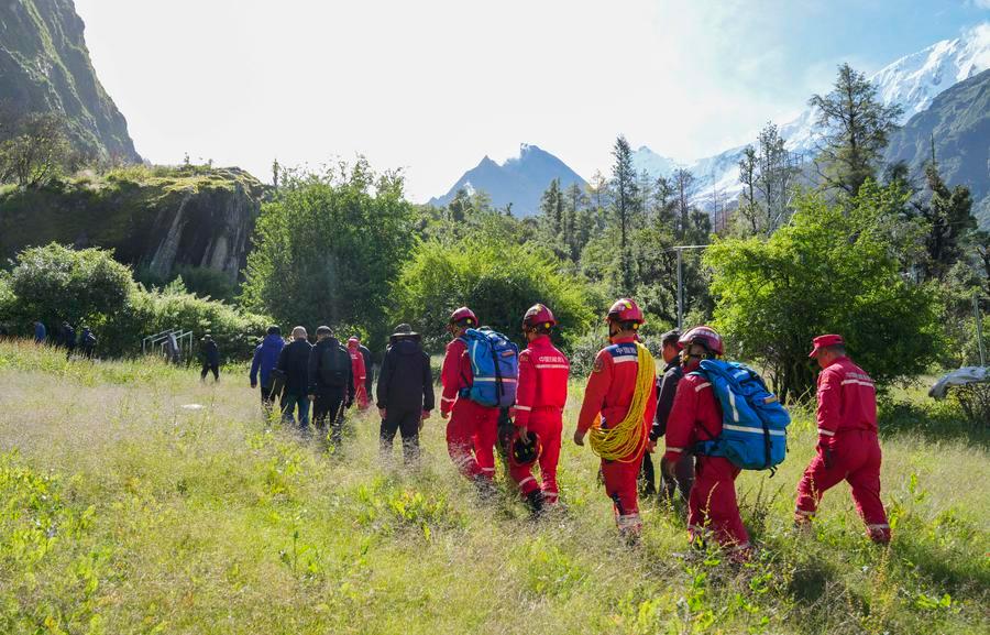 Experts conduct on-site surveys near a barrier lake formed upstream of the Gyirong Port in Gyirong County, southwest China's Xizang Autonomous Region, Aug. 28, 2026. (Xinhua/Jigme Dorje)