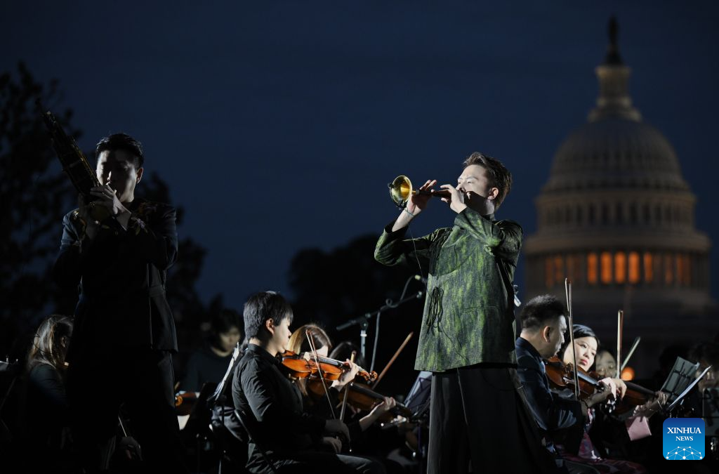 Chinese Suona performer Lin Wei (R, Front) and Sheng performer Jin Ziqi (L, Front) perform Music from Black Myth: Wukong -- Excerpt during "Future Resonance -- ShanghaiEye Night" in Washington, D.C., the United States, on Oct. 3, 2026. The Shanghai-themed cultural exchange event was held here on Saturday, bringing a taste of Shanghai to the United States. The event was also part of the "Shanghai Let's Meet" city promotion initiative and a broader series of China-U.S. people-to-people exchanges. (Xinhua/Li Rui)