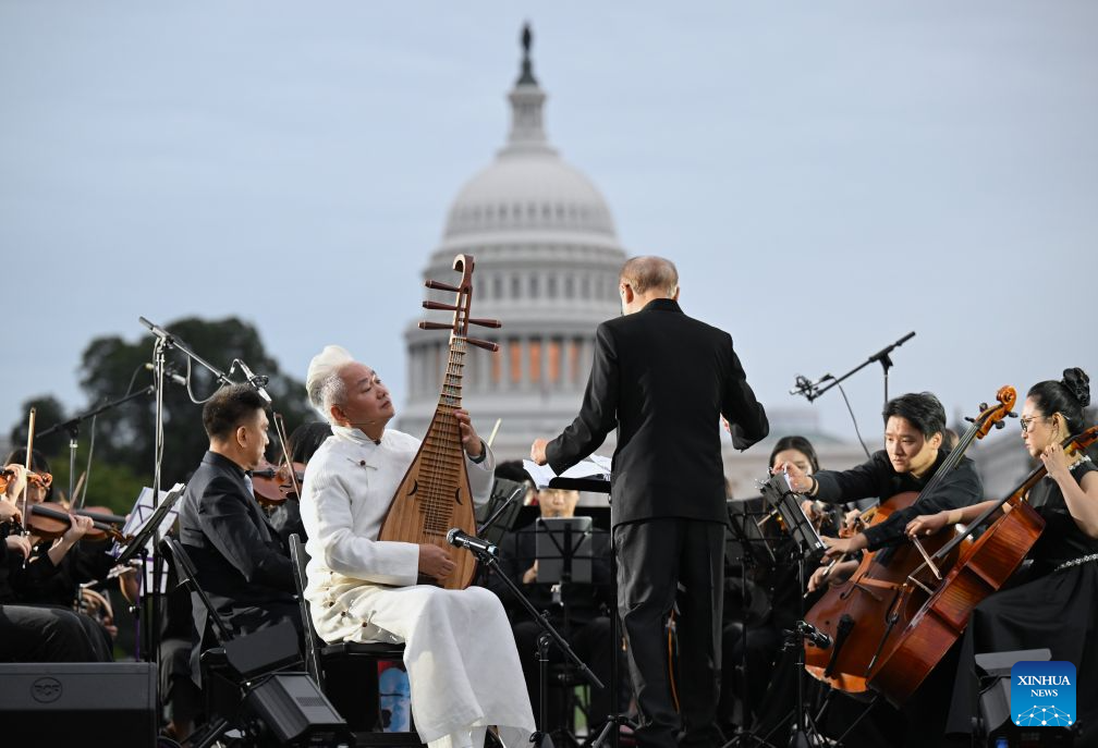 Chinese five-string pipa virtuoso Fang Jinlong performs with Manhattan Philharmonic during "Future Resonance -- ShanghaiEye Night" in Washington, D.C., the United States, on Oct. 3, 2026. The Shanghai-themed cultural exchange event was held here on Saturday, bringing a taste of Shanghai to the United States. The event was also part of the "Shanghai Let's Meet" city promotion initiative and a broader series of China-U.S. people-to-people exchanges. (Xinhua/Li Rui)