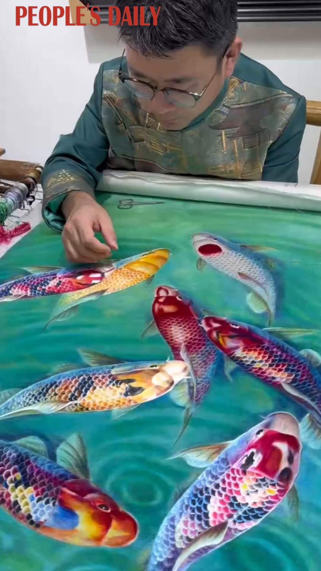 Su embroidery brings koi fish to life with delicate stitches