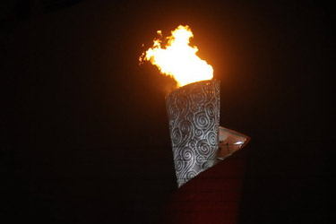 The last torch bearer Li Ning lights the cauldron