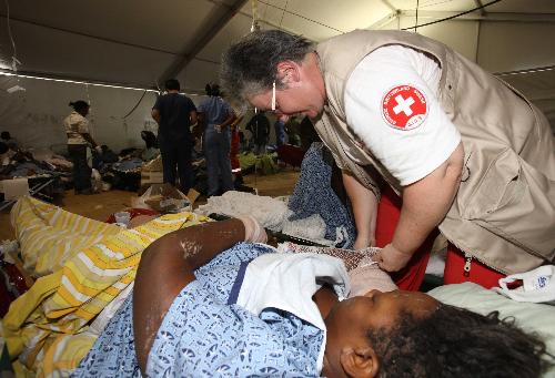 Doctors treat patients around the clock in Haiti's major temporary hospital