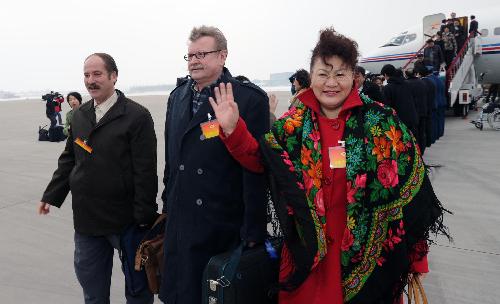 CPPCC members arrive in Beijing for new session