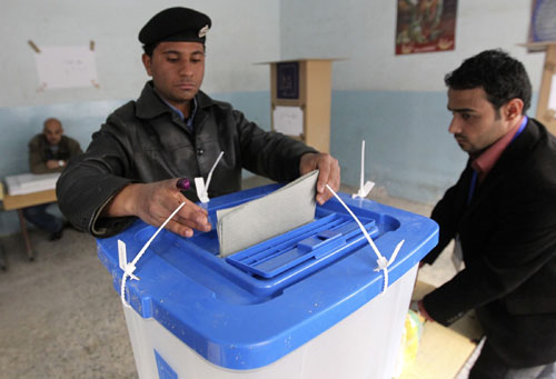 Bomb attacks kill 12 as early parliamentary voting begins in Iraq 