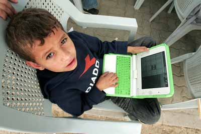 UNRWA distributes laptops to Palestinian school children