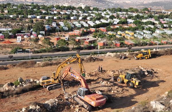 PNA cabinet calls on Israel to halt settlement