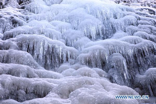 Amazing scenery of frozen waterfall in E. China