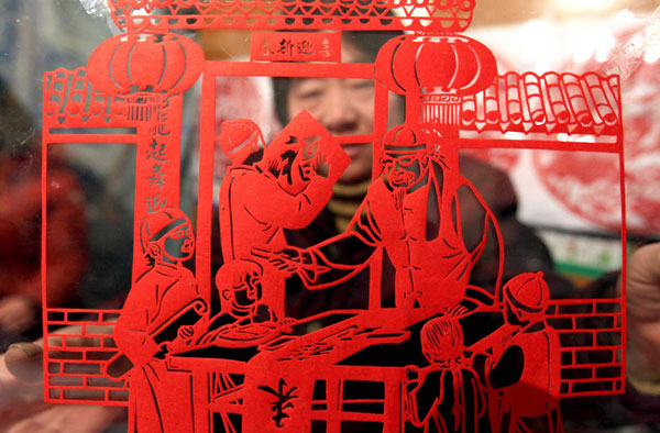 The joy of New Year carved into red paper