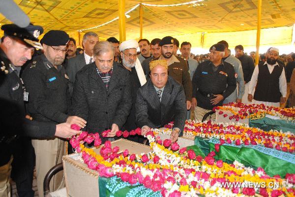 Pakistan holds funeral for police officials killed in suicide bombings