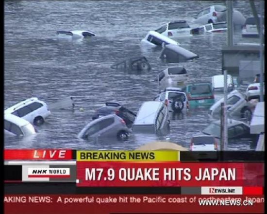 NHK: Tsunami sweeps cars, houses, buildings