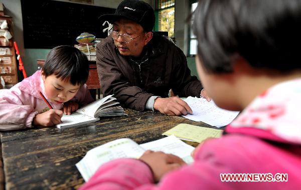 Rural teacher and his six Miao ethnic group pupils