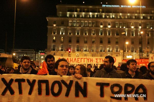 Greek labor unions protest over austerity measures and military intervention in Libya