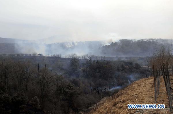 Mountain fire raging in NE China, no deaths reported