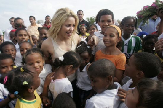 Shakira visits under-construction school funded by her charity group